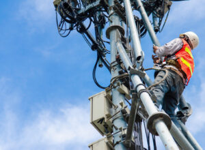 telecommunication tower worker uses rugged device